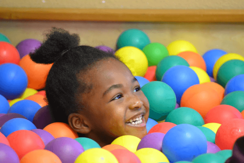Paragould office kid playing in ball pit
