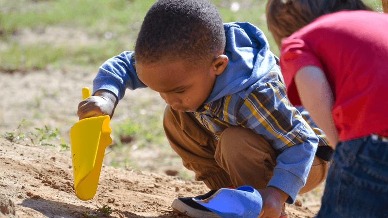 Child playing in sand.